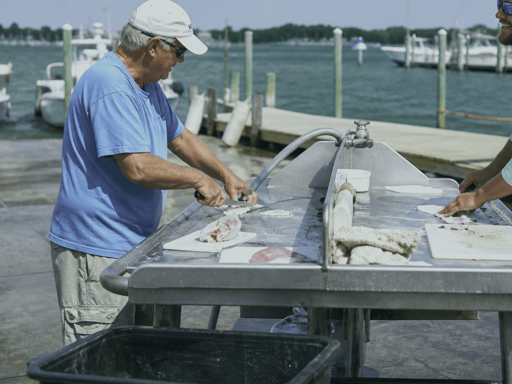 Bait cutting table etiquette at ramps: clean cuts, quick turns, no territorial drama — supporting Beach Blog photo, Ocean City, Maryland
