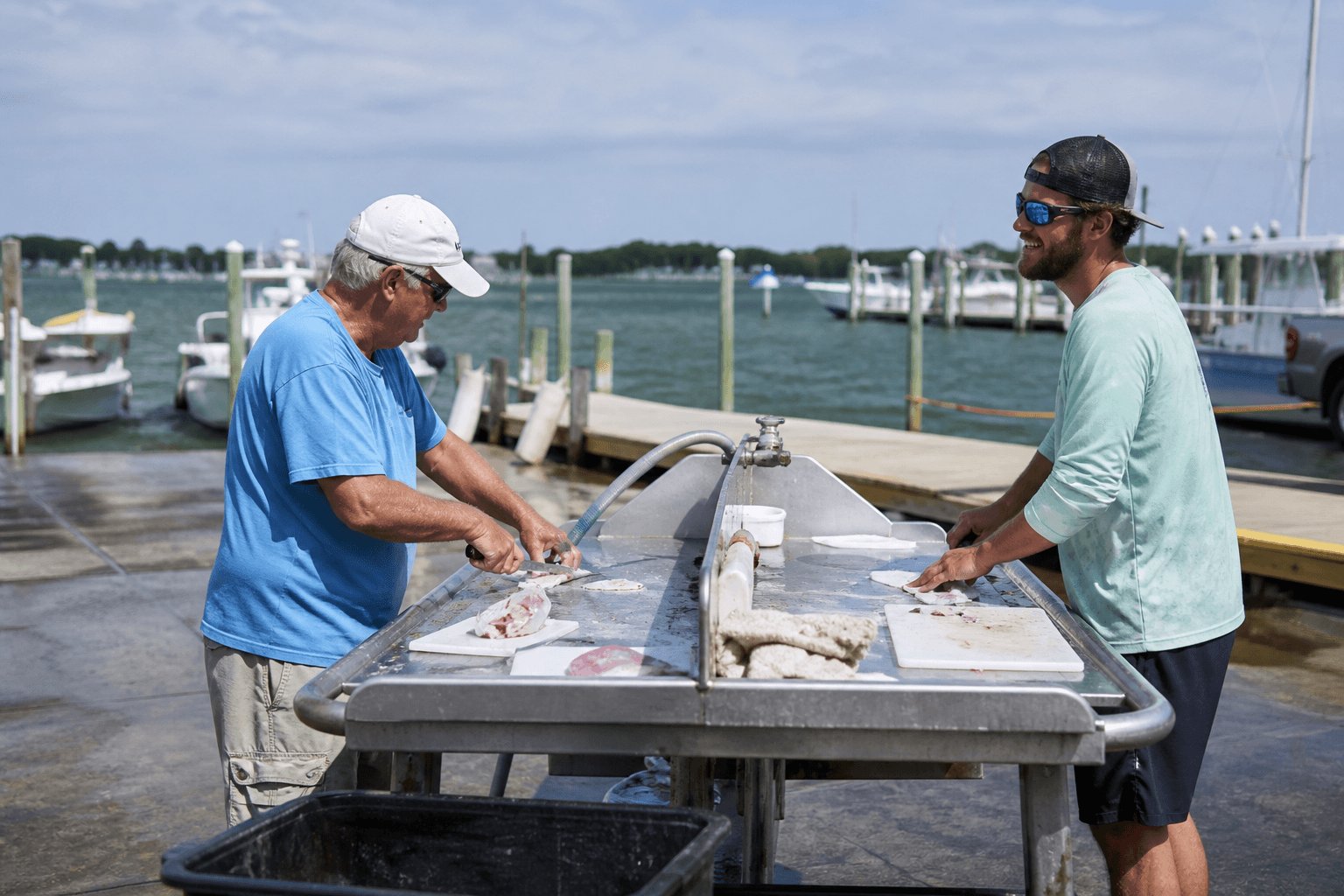 Bait cutting table etiquette at ramps: clean cuts, quick turns, no territorial drama — Beach Blog photo, Ocean City, Maryland