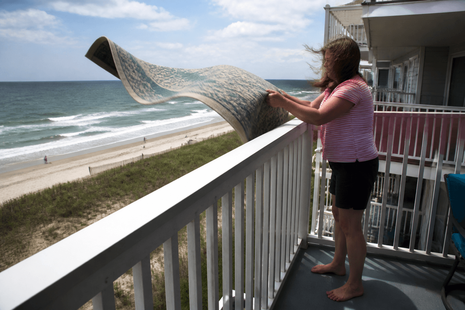 Balcony rug shake: always downwind of neighbors — Beach Blog photo, Ocean City, Maryland