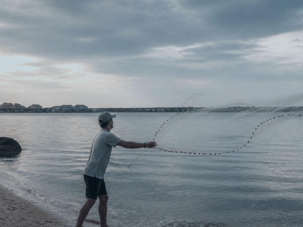 Cast net beginner humility: practice on grass before you invent pier comedy — supporting Beach Blog photo, Ocean City, Maryland