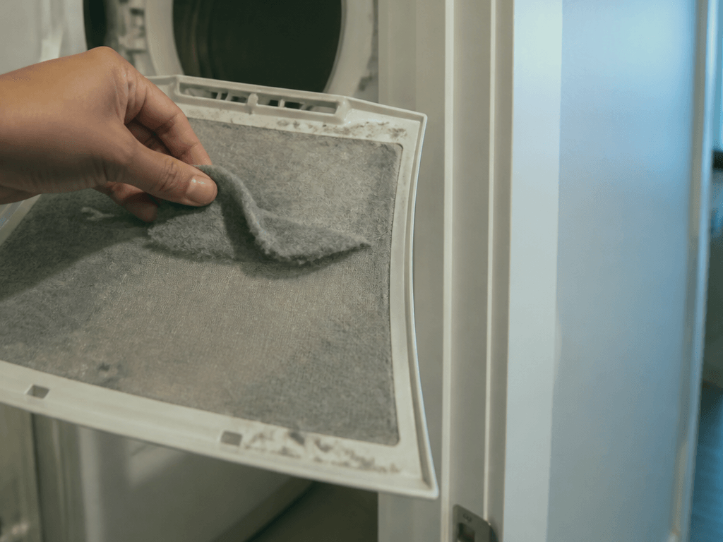 Condo washer lint trap: clean it or smell smoke later — supporting Beach Blog photo, Ocean City, Maryland