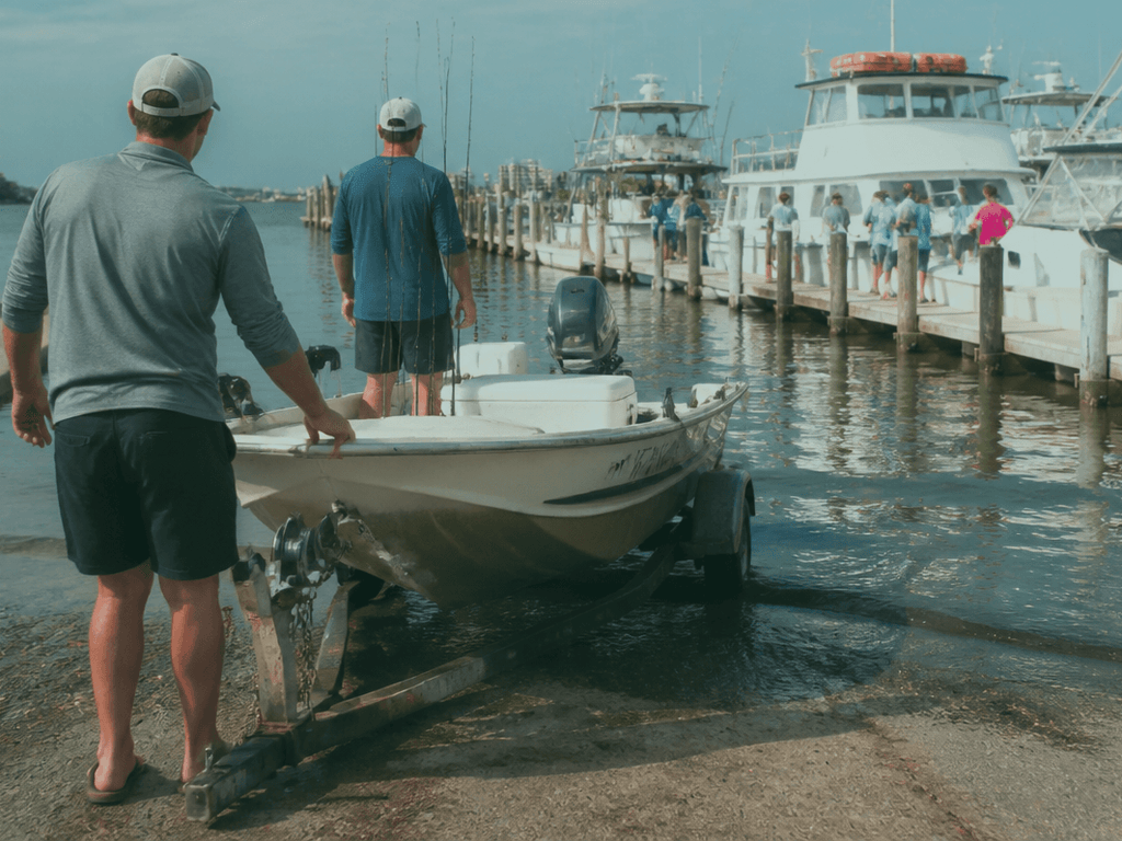 Rental fishing boat at a West Ocean City dock with tackle and life jackets staged on the gunwale