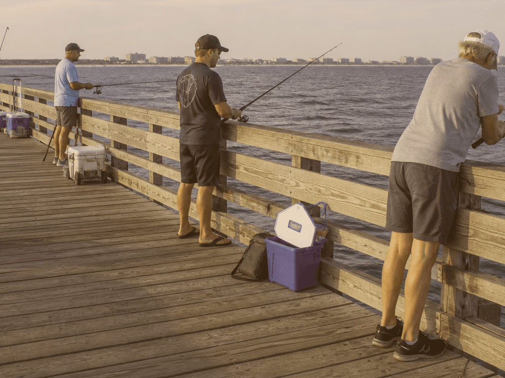 Close-up of a pier pass and tackle box on the Ocean City fishing pier rail