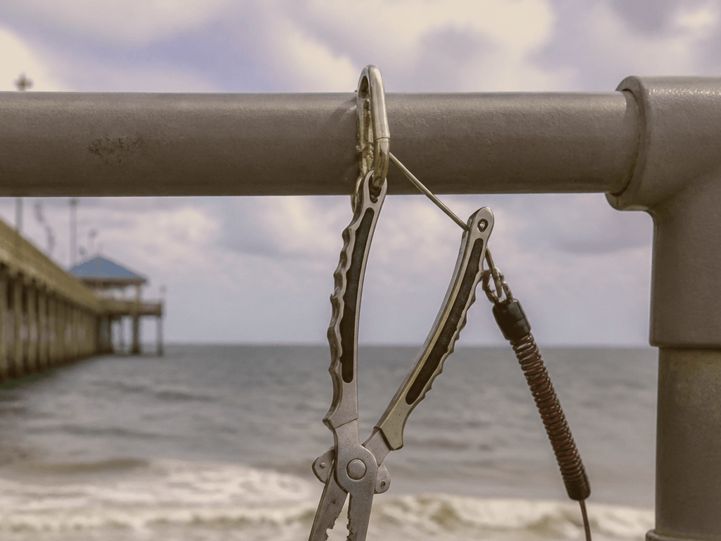 Fishing pliers on a leash: tools that stay on the pier — supporting Beach Blog photo, Ocean City, Maryland