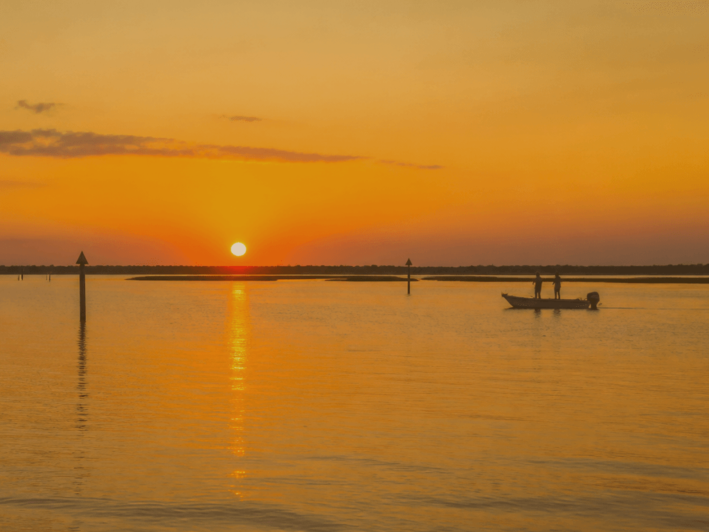 Kayak and fishing rod at quiet back-bay launch near West Ocean City Maryland