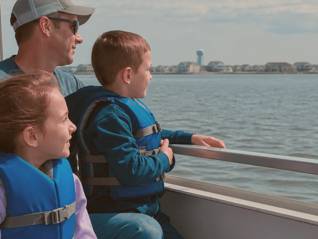 Cooler and life jackets staged on a bay boat deck during a family cruise near Ocean City Maryland