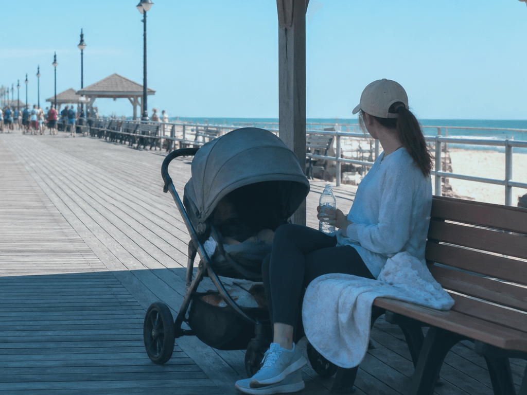 Ocean City Boardwalk stroller shade break: stop before the stroller nap becomes a protest — supporting Beach Blog photo, Ocean City, Maryland