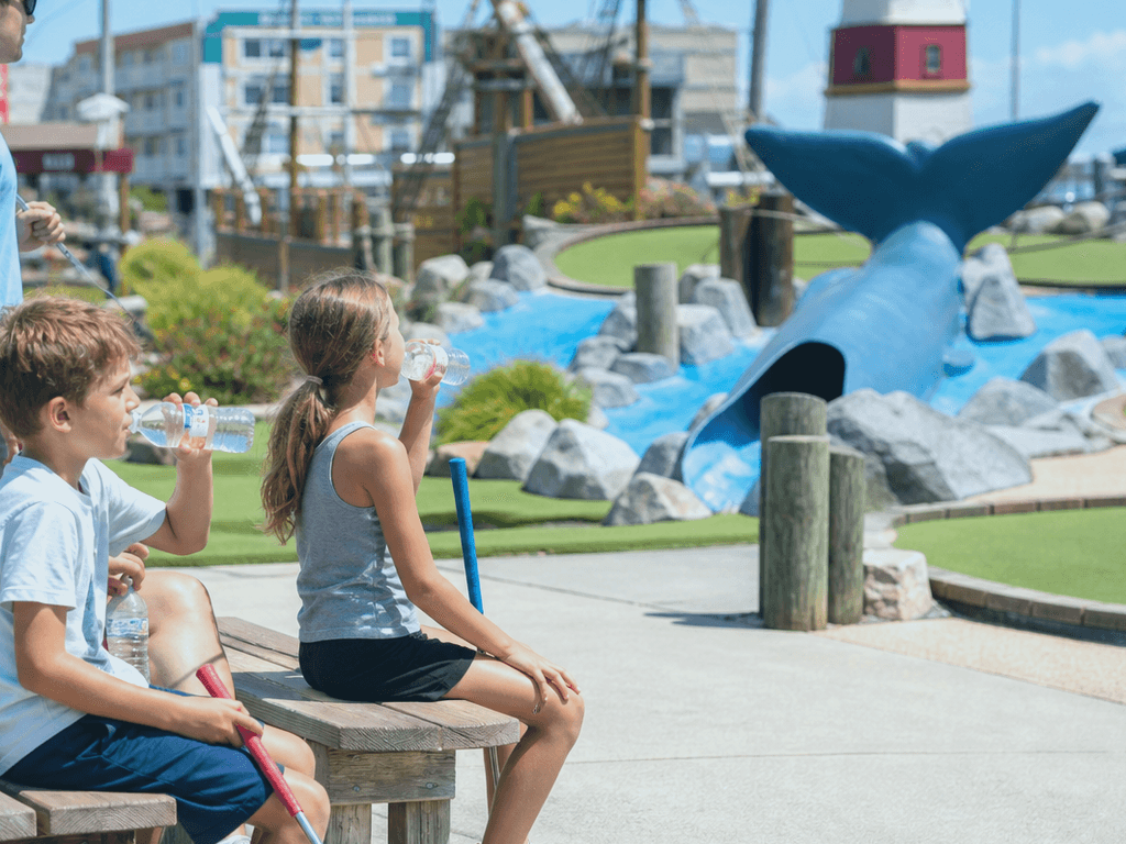 Ocean City family mini-golf sun break: pause before the back nine — supporting Beach Blog photo, Ocean City, Maryland
