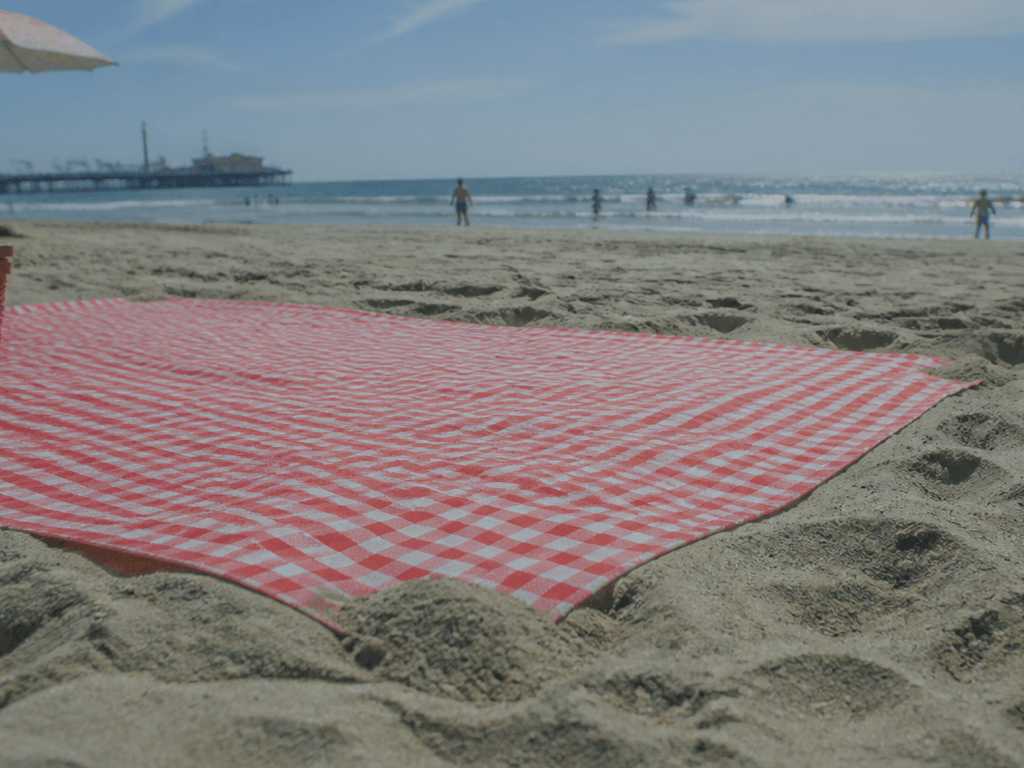 Picnic blanket sand anchors: corners first — supporting Beach Blog photo, Ocean City, Maryland