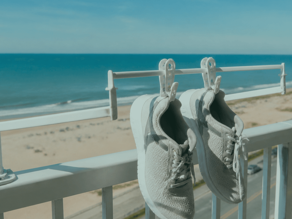 Shoe dryer rack on the balcony rail: air beats odor — supporting Beach Blog photo, Ocean City, Maryland