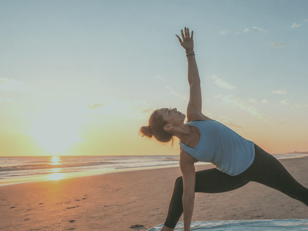 Sunrise yoga or mobility on the sand: quiet practice before the umbrella city — supporting Beach Blog photo, Ocean City, Maryland